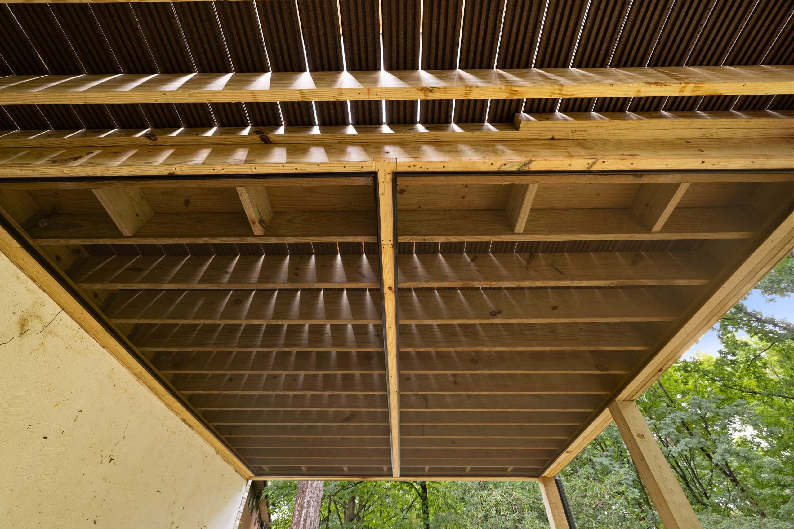 Detail of the Venice deck underside showing tight pressure-treated joist framing and beams