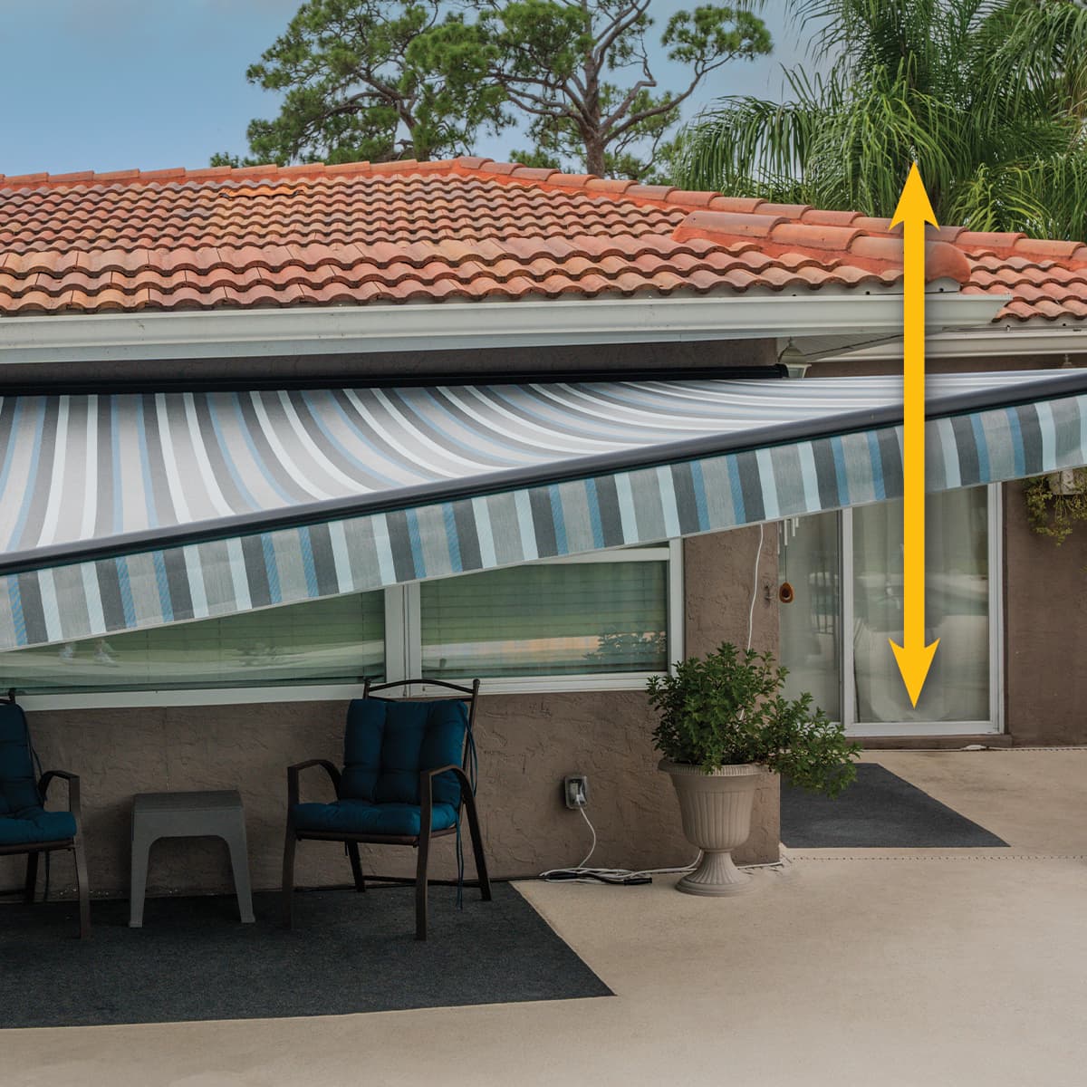 SunPro awning over a patio showing the adjustable EZ pitch angle range