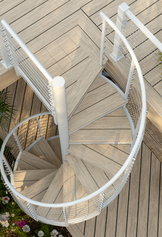 Trex Spiral Stairs Summit with a Classic White frame over a Trex deck