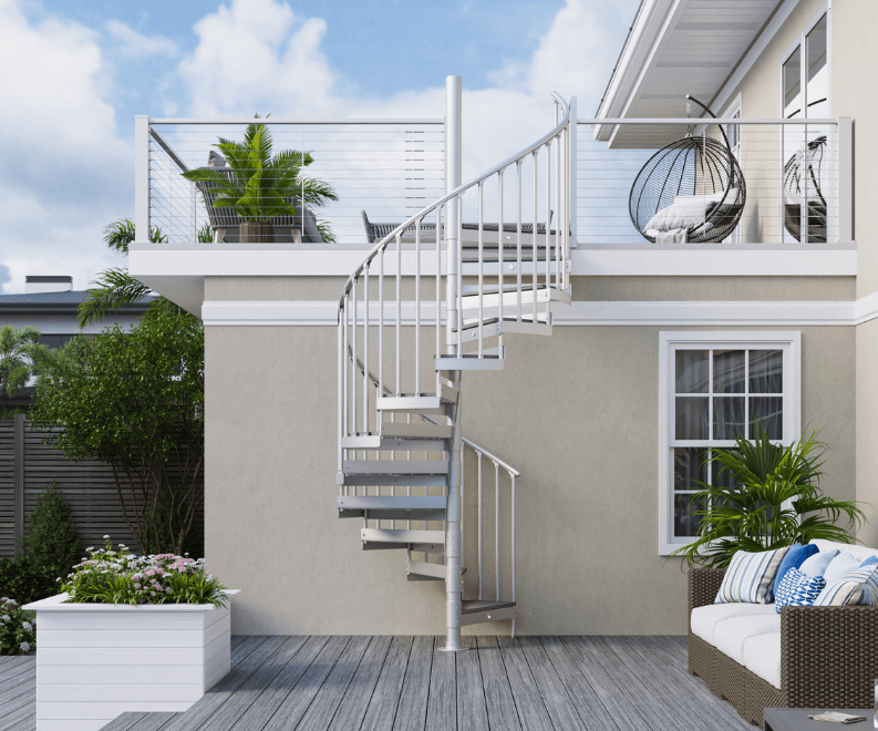 Trex Spiral Stairs Vista in white with aluminum balusters connecting an upper deck to a patio