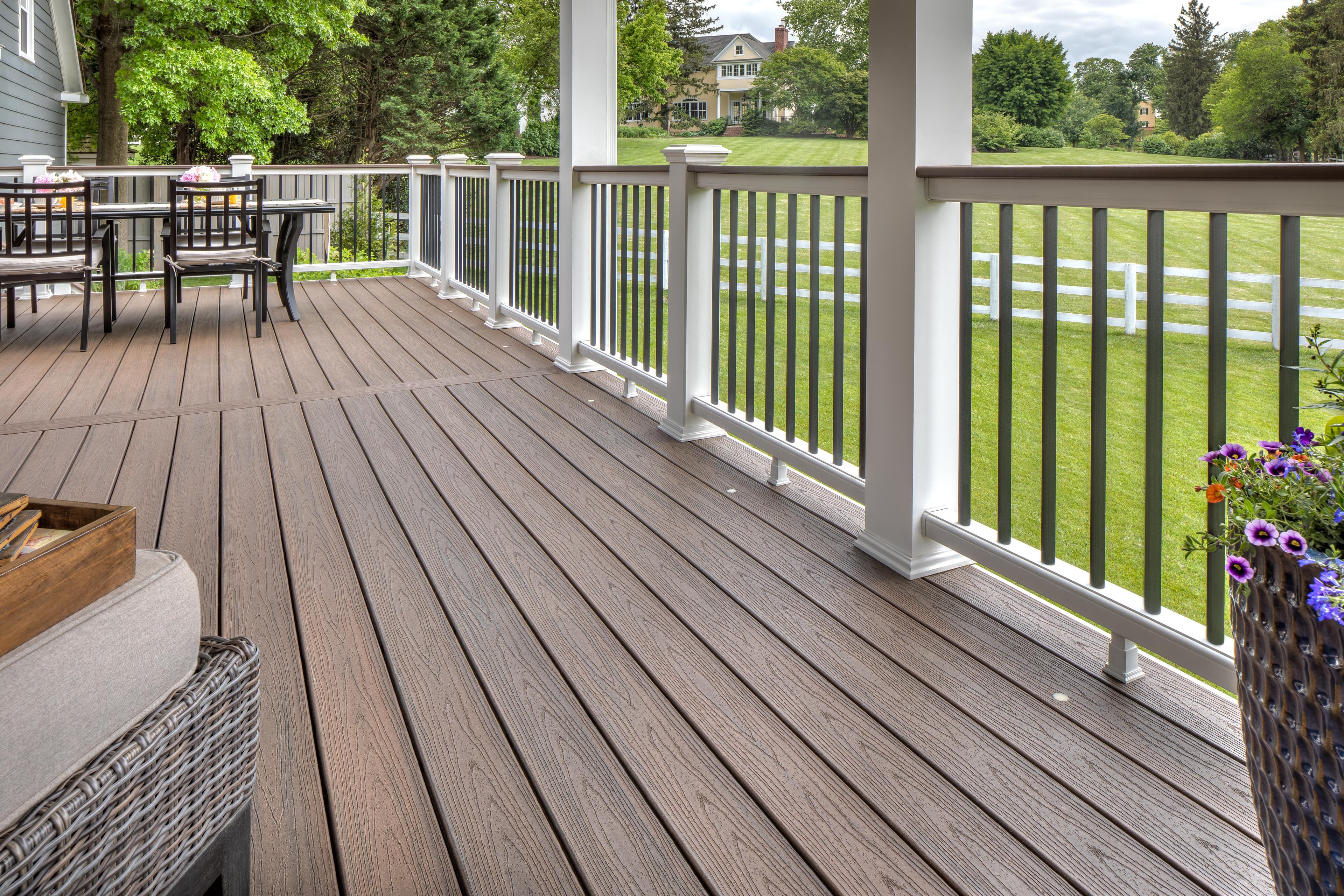 Trex Transcend Spiced Rum decking with backyard table and planters