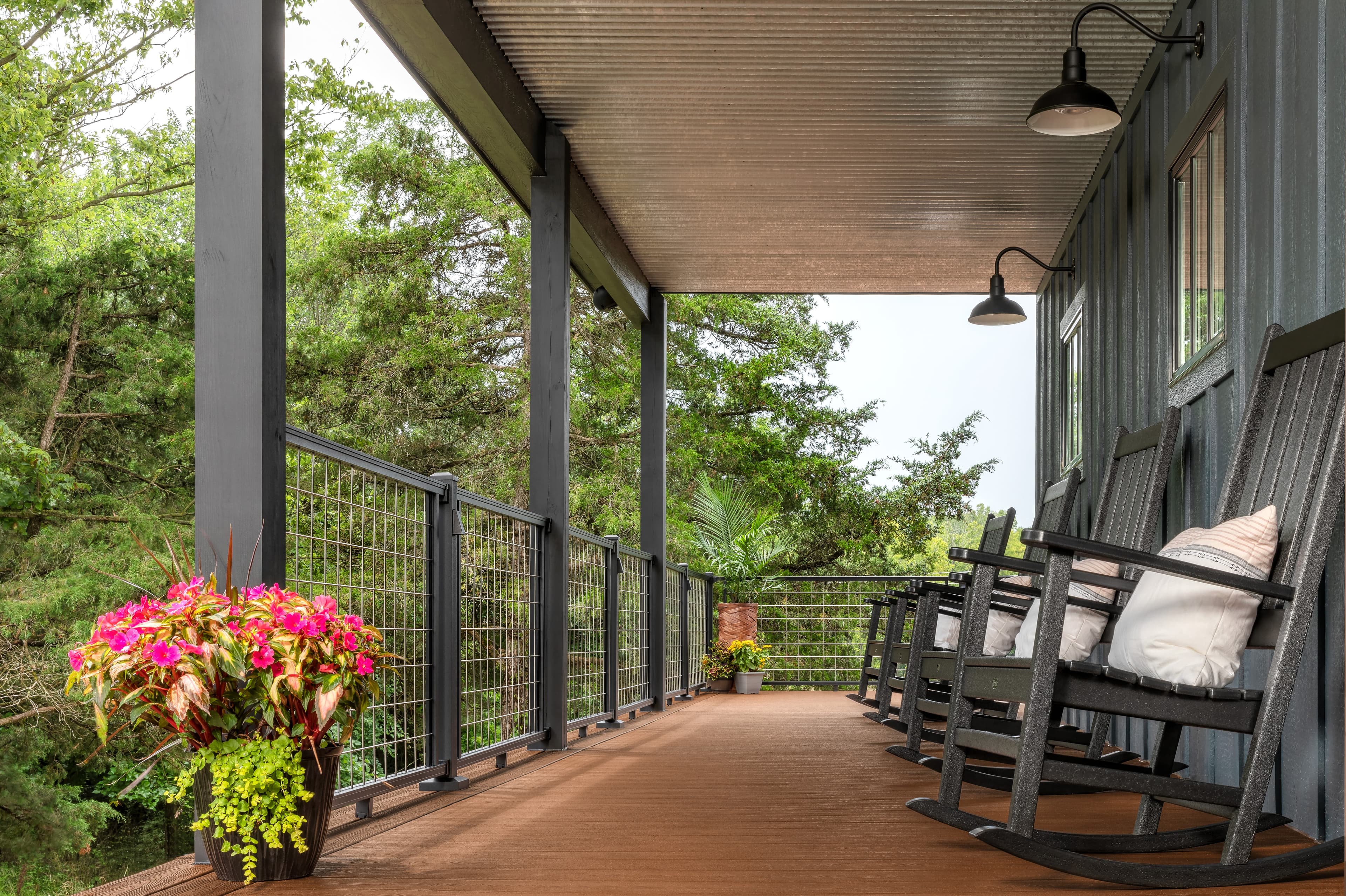 Trex Signature mesh railing on a porch with rocking chairs